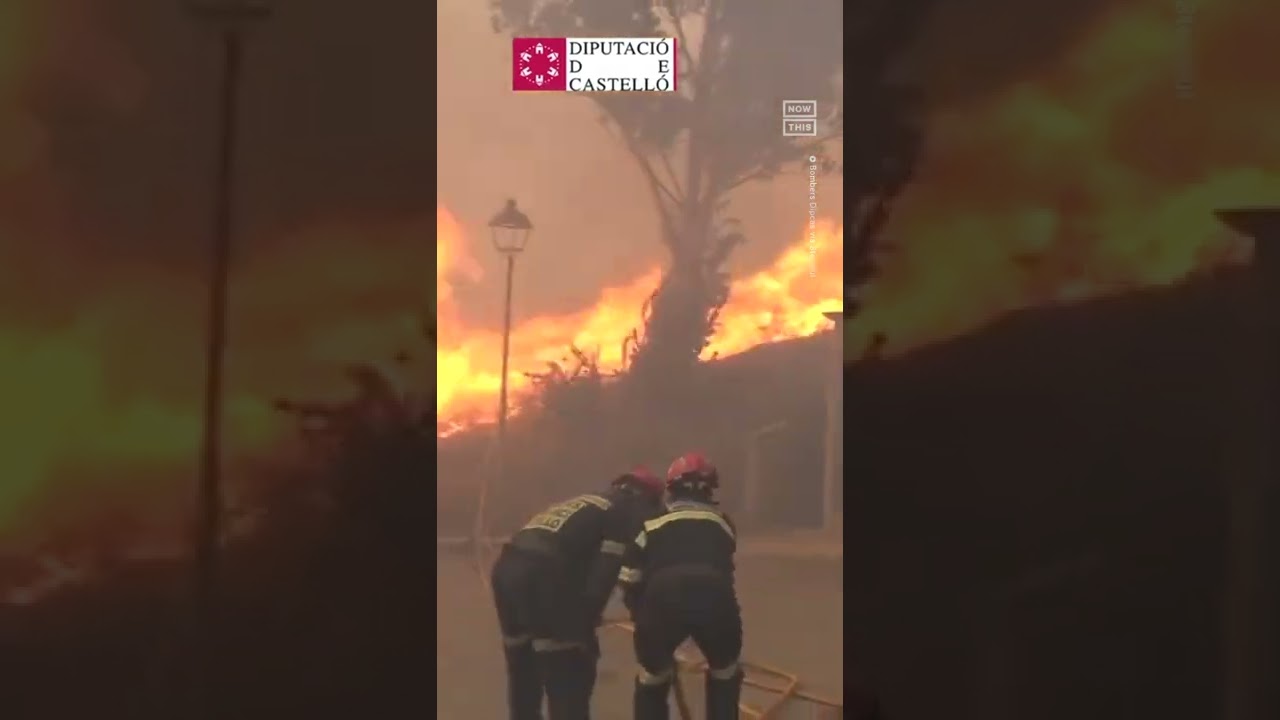 Firefighters Flee From Out Of Control Wildfire In Spain