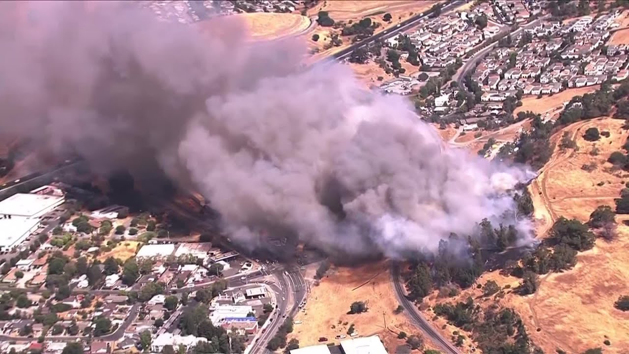 Raw Video: Vegetation Fire Burns Near Buildings In Martinez