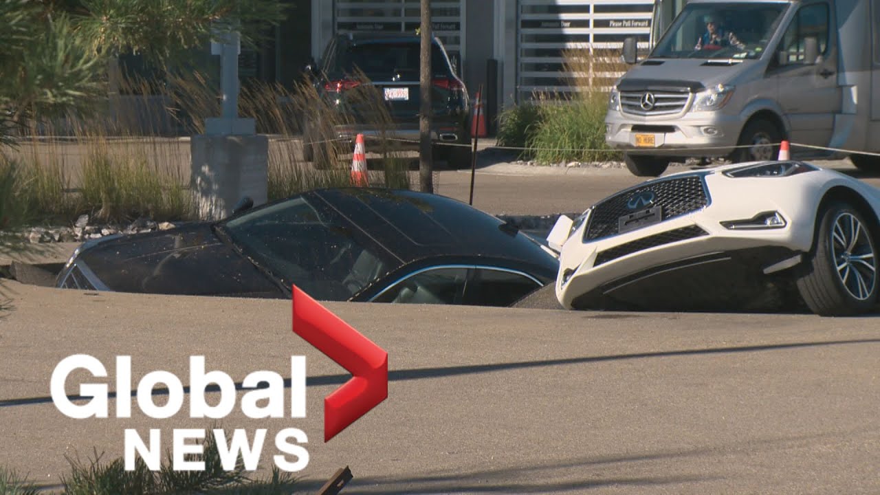 Sinkhole Swallows Several Cars At Edmonton Dealership