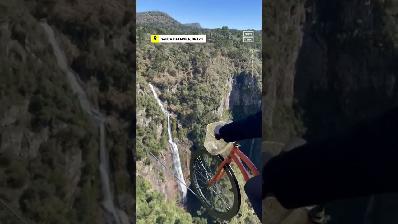 tourist rides bike across slack