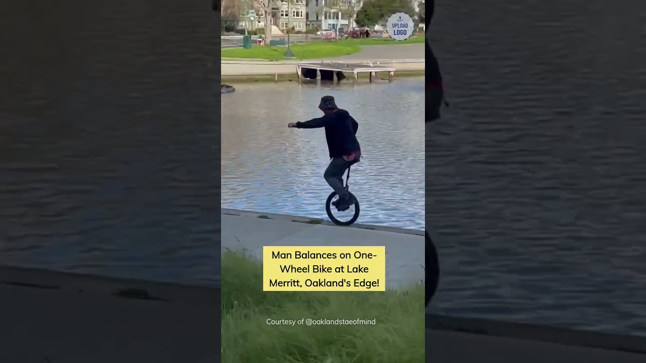 man balances on one wheel bike a