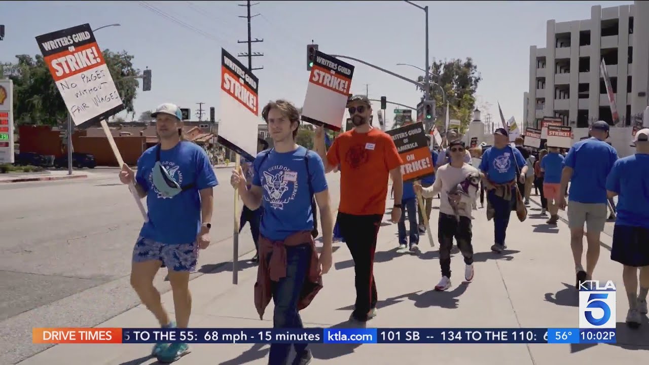Writers Picket Warner Brothers, Disney, Cbs And More As Strike Begins