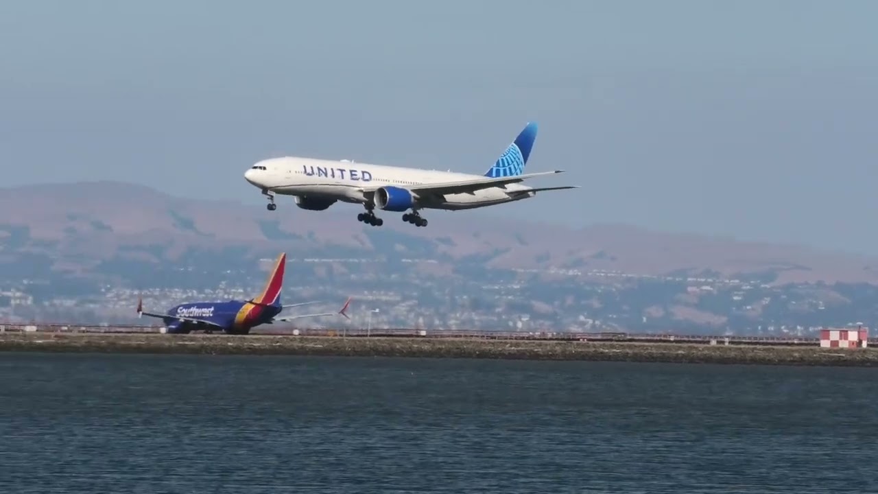 United Airlines B777 222 Landing At Sf International Airport .