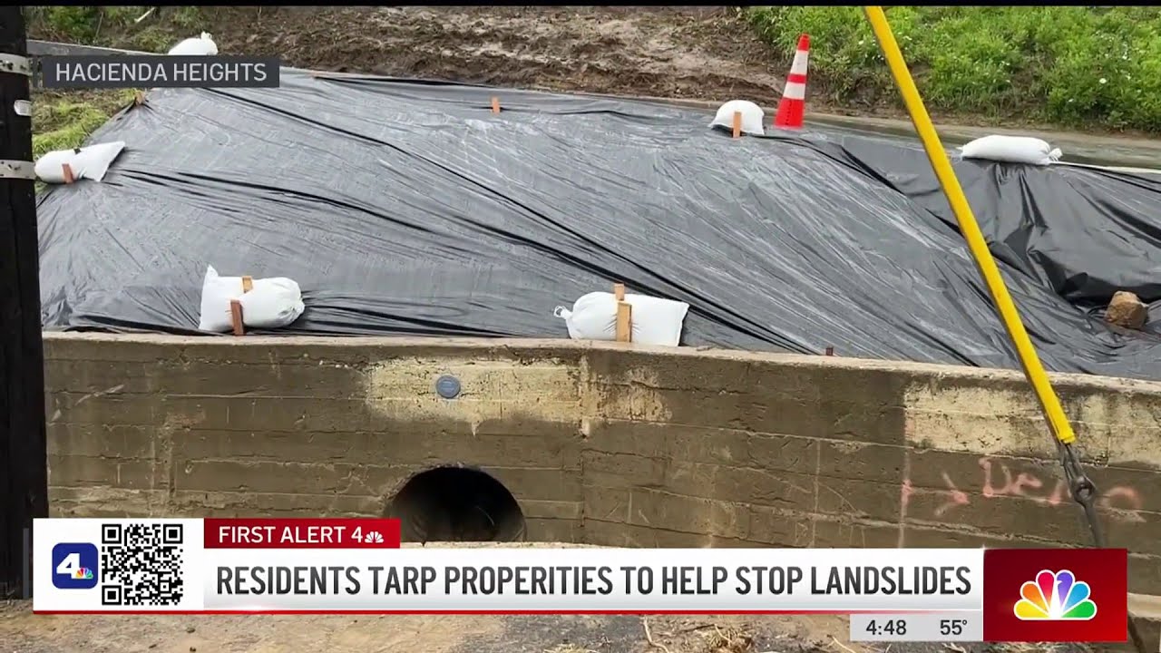 hillside residents tarp homes in