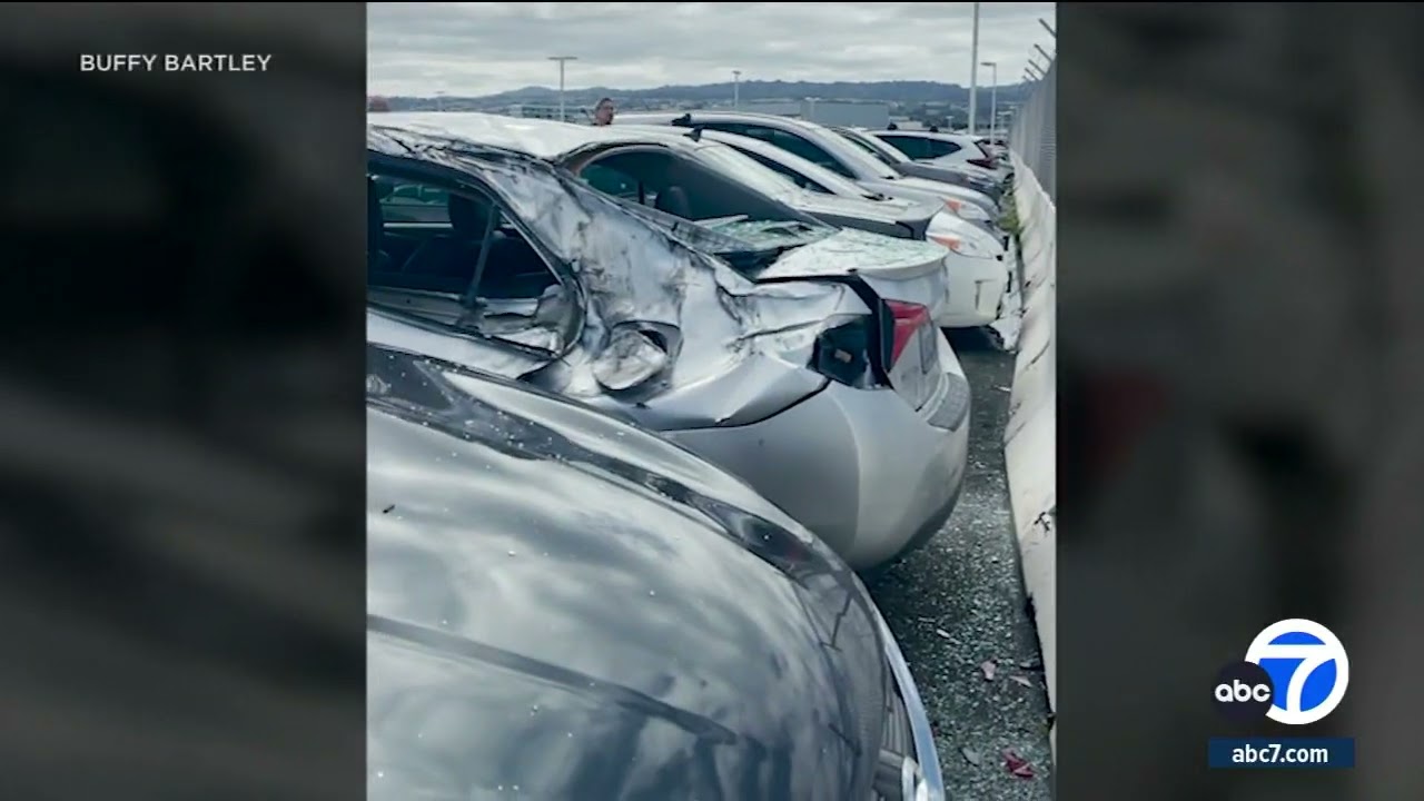 Cars at San Francisco airport employee parking lot damaged by falling tire from United plane 2 cars at san francisco airport em