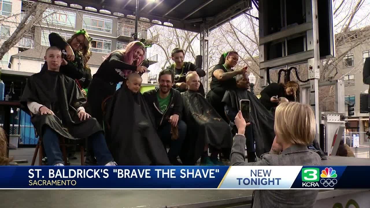 Dozens sit in barber’s chair, raising money for child cancer research 2 dozens sit in barbers chair rais
