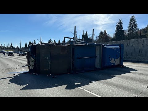 recycling truck rolls over on we