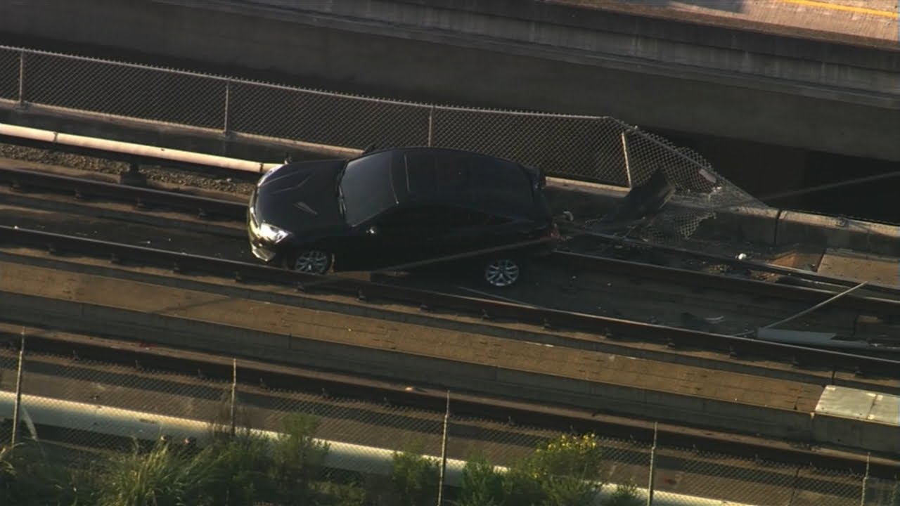 Vehicle flies off tow truck and onto the BART tracks on I-580 in Castro Valley, CHP says-WATCH LIVE 2 vehicle flies off tow truck and