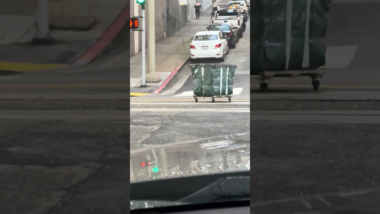 runaway laundry cart hits parked